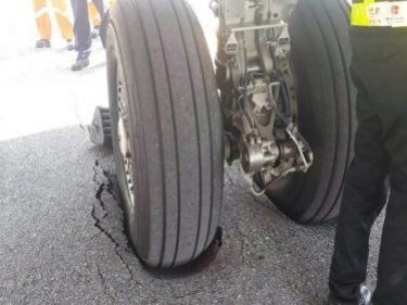 Aircraft Wheel Sinks Into Soft Surface at Thai Airport