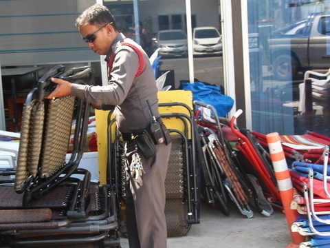 Phuket police seize beach furniture in Patong